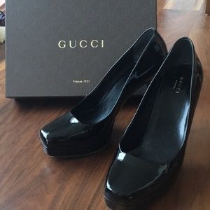 Black patent leather Gucci platform heels.